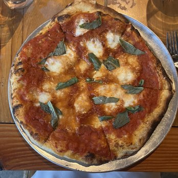 Taverna Rustic Italian signature dishes Spaghetti and Meatballs, Wood-Fired Pizzas, Chicken Parmesan, Gnocchi